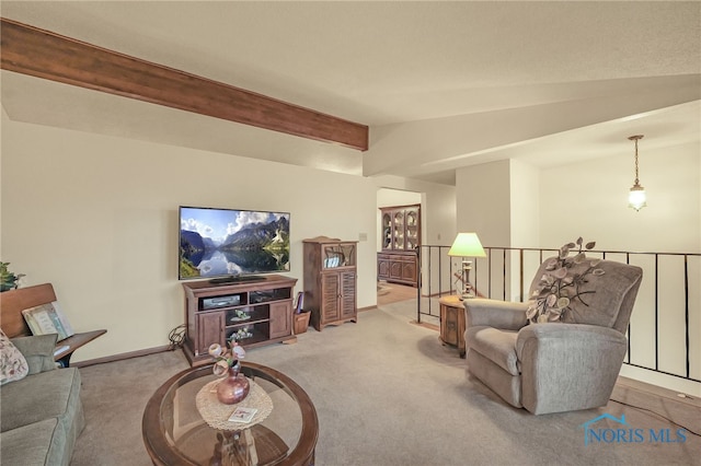 carpeted living room with lofted ceiling with beams