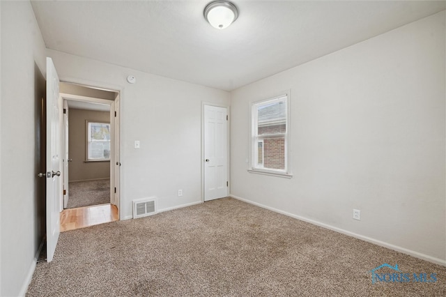 unfurnished bedroom with carpet floors