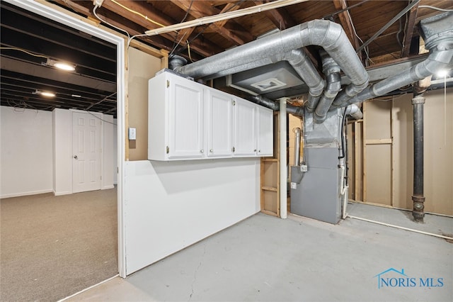 basement featuring heating unit