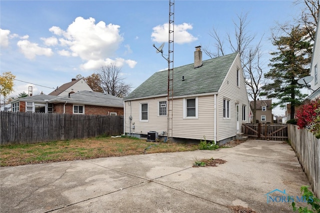 back of property featuring cooling unit