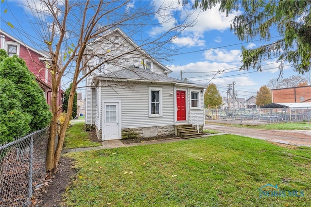 bungalow-style house featuring a front yard