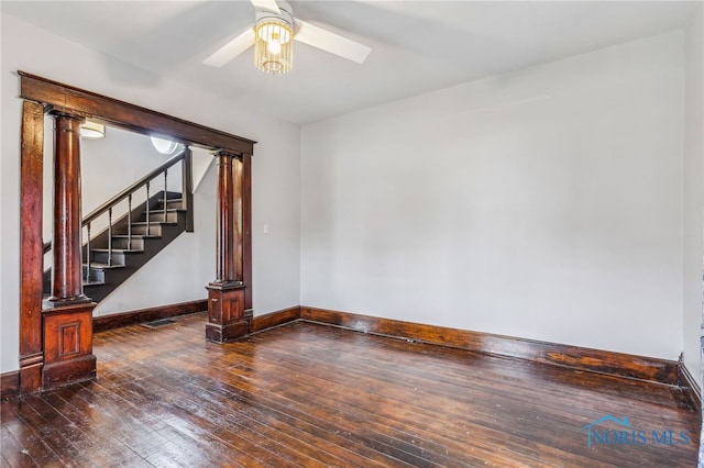 empty room featuring dark hardwood / wood-style flooring and ceiling fan