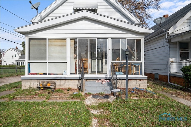 view of front facade featuring a sunroom