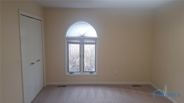 view of carpeted spare room