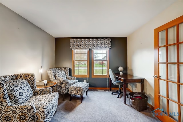 living area featuring carpet floors