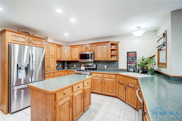 kitchen featuring a center island, sink, stainless steel appliances, backsplash, and light tile patterned floors