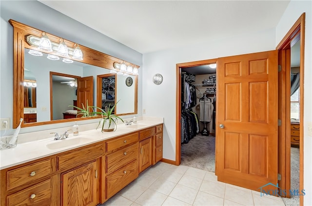 bathroom with tile patterned floors and vanity