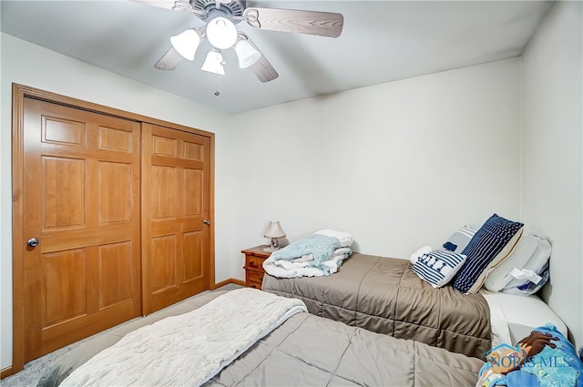 bedroom with ceiling fan and a closet