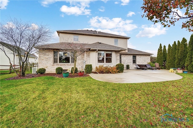 back of property with a yard, a patio, and central AC unit