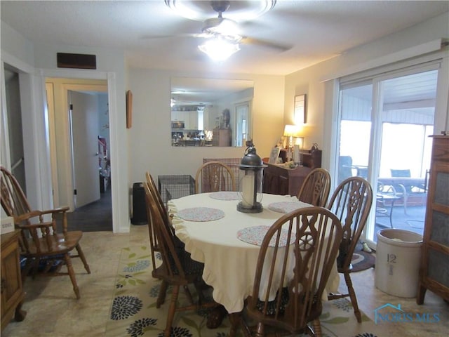 dining space featuring ceiling fan