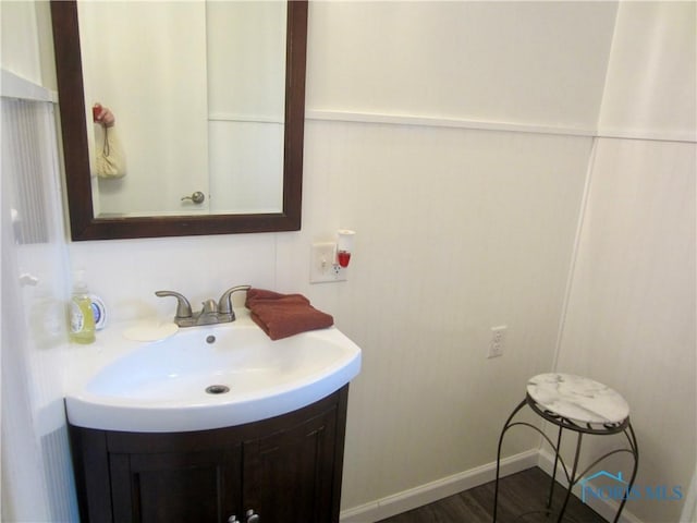 bathroom featuring hardwood / wood-style floors and vanity