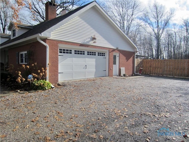 view of side of property with a garage