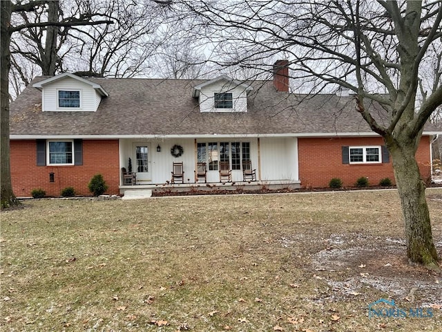 view of front of home featuring a front yard and a porch