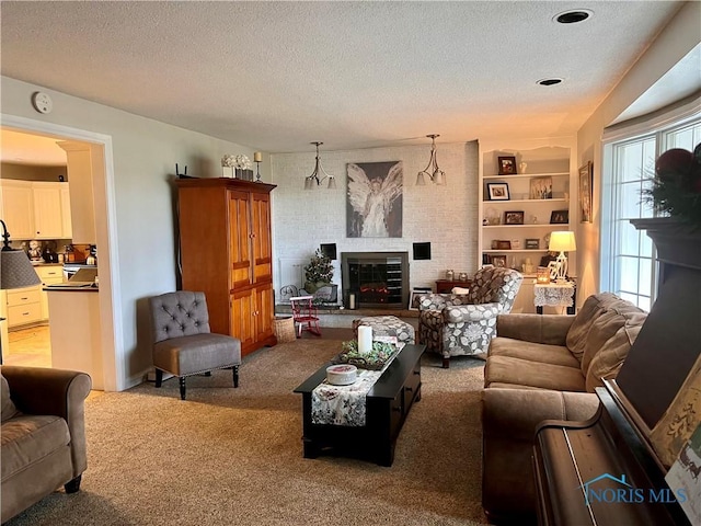 carpeted living room with built in features and a textured ceiling