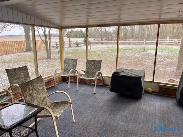 sunroom / solarium with a rural view