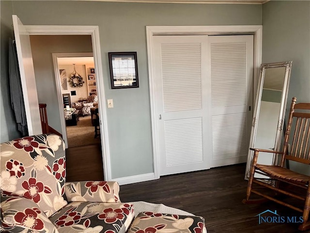 bedroom featuring a closet and dark wood-type flooring