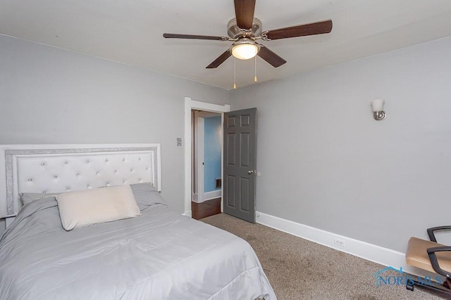 bedroom with ceiling fan and carpet