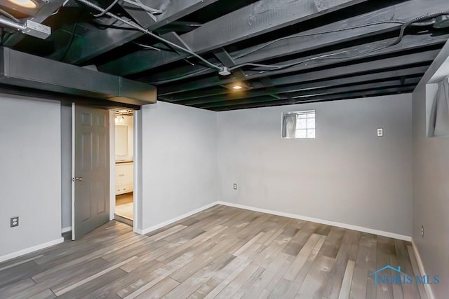 basement featuring hardwood / wood-style flooring