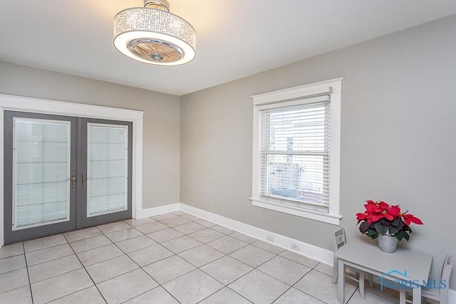 interior space featuring light tile patterned floors and french doors