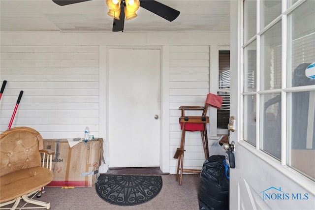 entrance to property with ceiling fan