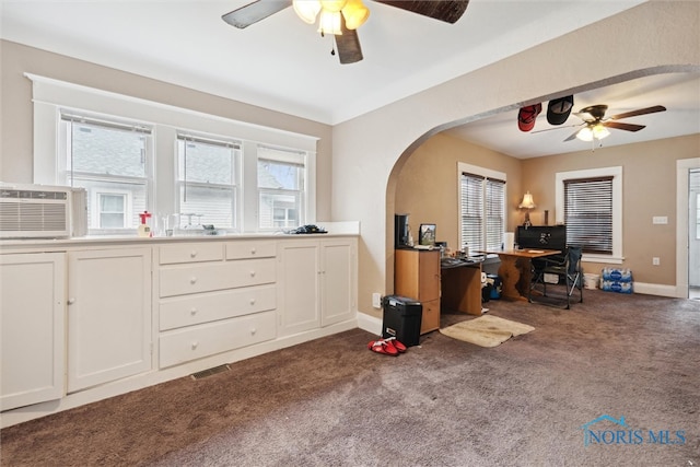 carpeted office space featuring ceiling fan and cooling unit