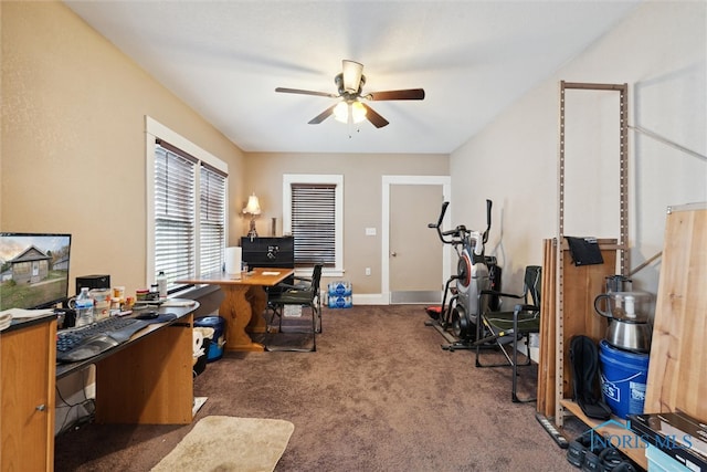 carpeted home office featuring ceiling fan