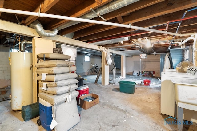 basement with separate washer and dryer and water heater