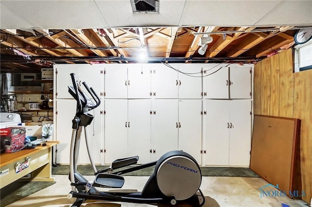 workout area with wood walls