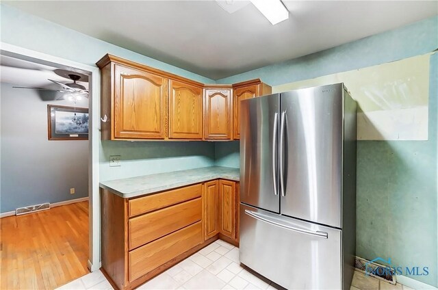 kitchen featuring stainless steel refrigerator