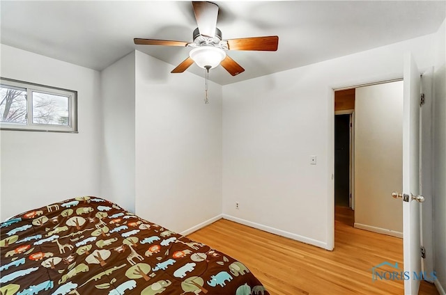 unfurnished bedroom with wood-type flooring and ceiling fan