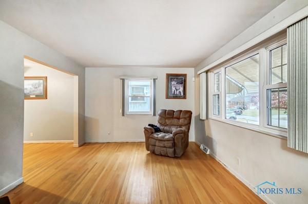 living area with light hardwood / wood-style floors