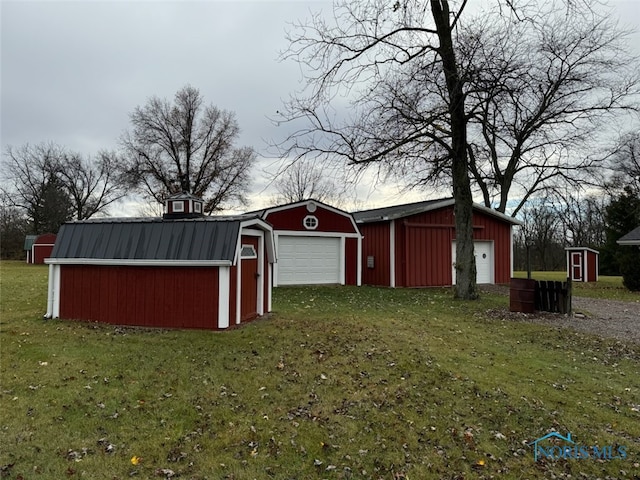 view of outdoor structure with a lawn