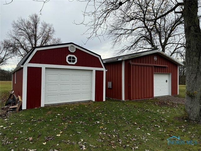 garage with a yard