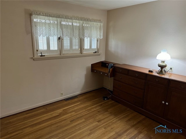 unfurnished bedroom featuring hardwood / wood-style floors