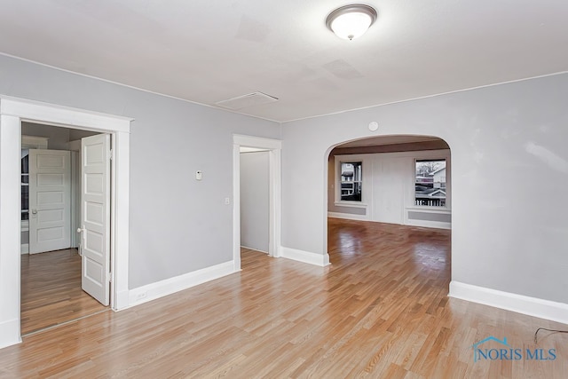 empty room with light hardwood / wood-style flooring