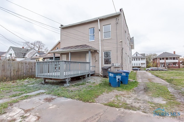 back of house featuring a deck