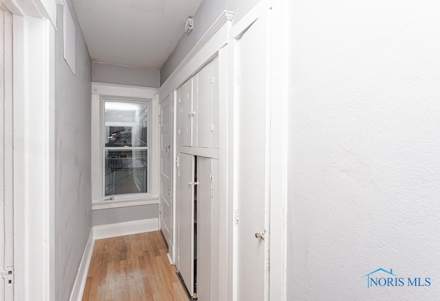 corridor featuring light hardwood / wood-style floors