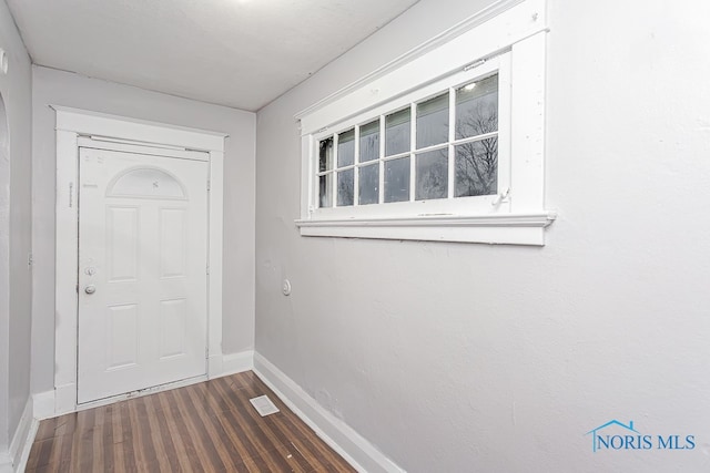 doorway featuring dark hardwood / wood-style flooring