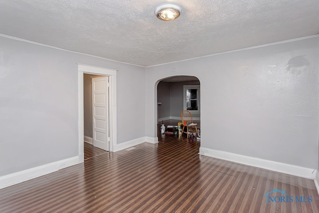 unfurnished room with dark hardwood / wood-style flooring and a textured ceiling