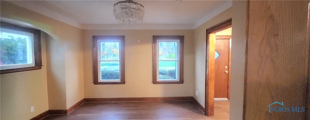 entryway featuring dark hardwood / wood-style floors and an inviting chandelier