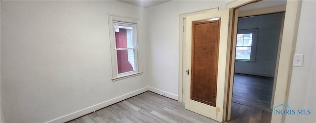 spare room featuring light wood-type flooring