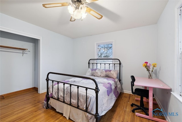 bedroom featuring hardwood / wood-style floors and ceiling fan