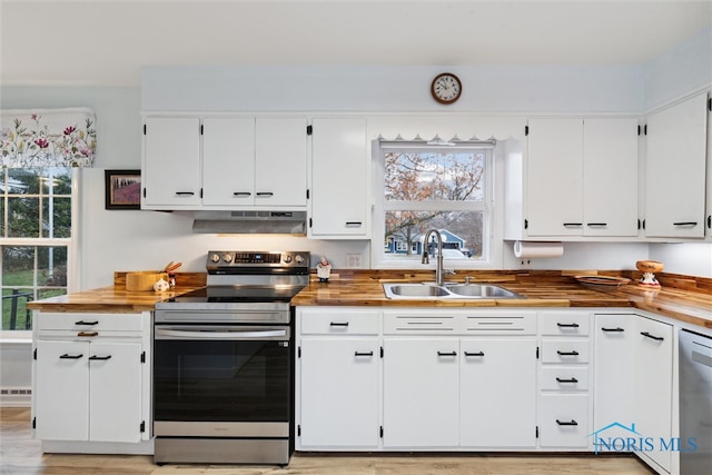 kitchen featuring white cabinetry, plenty of natural light, stainless steel appliances, and sink