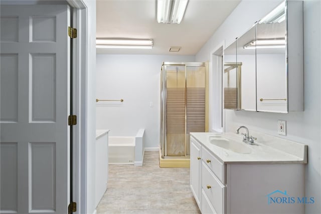 bathroom with separate shower and tub and vanity