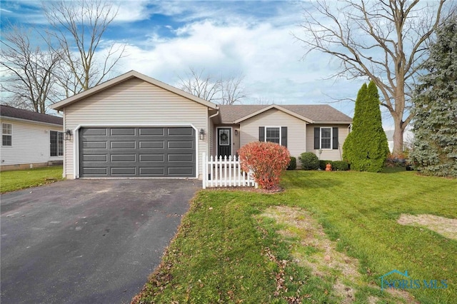 ranch-style house featuring a front yard and a garage