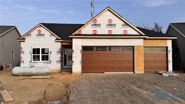 property in mid-construction featuring a garage