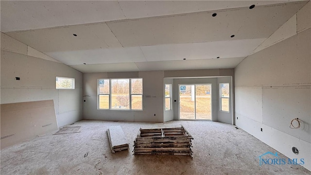 empty room with vaulted ceiling