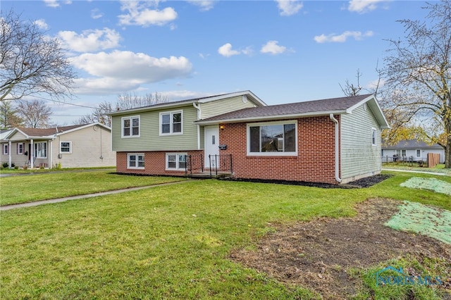 tri-level home featuring a front yard