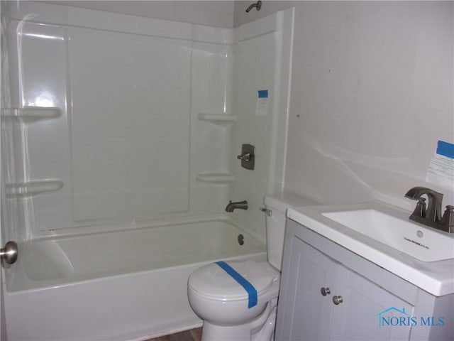 full bathroom featuring vanity, shower / bathtub combination, and toilet