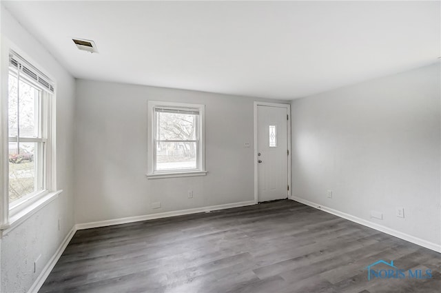 entrance foyer with dark hardwood / wood-style floors